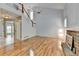 Living room with hardwood floors, high ceilings, and fireplace at 2455 Kirkstone Dr, Buford, GA 30519