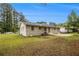 Side view of the backyard showing the exterior of the home, lawn and patio at 354 Tarragon Sw Way, Atlanta, GA 30331