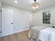 Comfortable bedroom features natural light, neutral tones, and modern lighting, creating a peaceful sanctuary at 354 Tarragon Sw Way, Atlanta, GA 30331