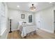 Bright bedroom with a cozy bed, large windows, and neutral walls, creating a relaxing retreat at 354 Tarragon Sw Way, Atlanta, GA 30331