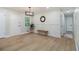 Inviting dining area with natural light, complemented by a decorative mirror, neutral tones and modern decor at 354 Tarragon Sw Way, Atlanta, GA 30331