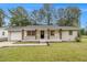 Charming renovated brick home featuring a well-maintained lawn and inviting front entrance at 354 Tarragon Sw Way, Atlanta, GA 30331