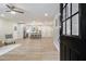 Open-concept living space featuring sleek flooring, a modern kitchen, and ample natural light at 354 Tarragon Sw Way, Atlanta, GA 30331