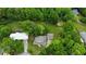 Overhead view showcasing the home's setting among mature trees and green spaces, highlighting its tranquil and private location at 3884 Vic Ar Ct, Peachtree Corners, GA 30360