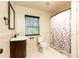 Bright bathroom showcasing vanity, toilet, shower/tub combo, and a window for natural light at 3884 Vic Ar Ct, Peachtree Corners, GA 30360