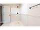 This bathroom has tile floors, a tile shower, and a door at 3884 Vic Ar Ct, Peachtree Corners, GA 30360