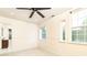 Large bedroom featuring ceiling fan, neutral walls, ensuite bathroom and dual windows offering great natural light at 3884 Vic Ar Ct, Peachtree Corners, GA 30360