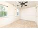 Bedroom featuring carpet, three windows, and large closet, providing plenty of space and natural light at 3884 Vic Ar Ct, Peachtree Corners, GA 30360