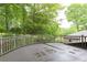The deck overlooks a lush green yard with mature trees at 3884 Vic Ar Ct, Peachtree Corners, GA 30360
