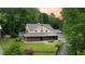 Inviting exterior with a full front porch, brick accents, and a well-maintained lawn creating a welcoming curb appeal at 3884 Vic Ar Ct, Peachtree Corners, GA 30360