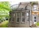 Back view of the brick home with an upper deck at 3884 Vic Ar Ct, Peachtree Corners, GA 30360