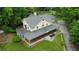 Aerial view of a large home with a wraparound porch and a circular balcony at 3884 Vic Ar Ct, Peachtree Corners, GA 30360