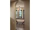 Hallway archway with a view into the dining room with a large table and many windows at 3884 Vic Ar Ct, Peachtree Corners, GA 30360