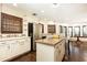 Open kitchen with granite island, stainless steel refrigerator, and plenty of counter space for food preparation at 3884 Vic Ar Ct, Peachtree Corners, GA 30360