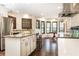 Stylish kitchen featuring white cabinets, granite countertops, stainless steel appliances, and a central island with seating at 3884 Vic Ar Ct, Peachtree Corners, GA 30360