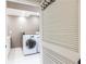 Convenient laundry room features a washer and dryer, ample space, and a louvered door at 3884 Vic Ar Ct, Peachtree Corners, GA 30360