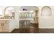 Bright living room with hardwood floors, a stone fireplace, and arched entryways to adjacent spaces at 3884 Vic Ar Ct, Peachtree Corners, GA 30360