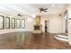 Spacious living room with hardwood floors and a stone fireplace, perfect for entertaining guests at 3884 Vic Ar Ct, Peachtree Corners, GA 30360