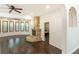 Living room featuring a stone fireplace, ceiling fans, and hardwood flooring at 3884 Vic Ar Ct, Peachtree Corners, GA 30360