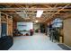 Unfinished basement with exposed ceiling, storage shelves, and work bench at 132 Picketts Creek Dr, Acworth, GA 30101