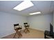 Finished basement space with two director style chairs and carpeted floors at 132 Picketts Creek Dr, Acworth, GA 30101