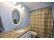 Bathroom featuring granite countertop and oval mirror at 132 Picketts Creek Dr, Acworth, GA 30101