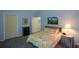 Comfortable bedroom with soft lighting, floral bedding, and ample closet space at 132 Picketts Creek Dr, Acworth, GA 30101