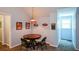 Upstairs dining area featuring a wood table with chairs, Coca-Cola decor, and natural light at 132 Picketts Creek Dr, Acworth, GA 30101