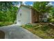 Home's exterior shows a brick facade, vinyl siding, a driveway, and well-maintained landscaping at 132 Picketts Creek Dr, Acworth, GA 30101