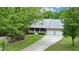 A charming home with a well-manicured lawn, two-car garage, and inviting front porch at 132 Picketts Creek Dr, Acworth, GA 30101