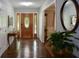Inviting foyer featuring hardwood floors, decorative front door and a view into other living areas at 132 Picketts Creek Dr, Acworth, GA 30101