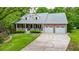 Charming brick home featuring a well-manicured lawn, a two-car garage, and a welcoming front porch at 132 Picketts Creek Dr, Acworth, GA 30101