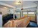 Garage with a wooden wheelchair ramp to main entry and two-car overhead door at 132 Picketts Creek Dr, Acworth, GA 30101