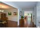 Hallway leading to dining and living room featuring hardwood floors and neutral paint at 132 Picketts Creek Dr, Acworth, GA 30101