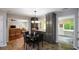 Eat-in kitchen with modern cabinets and breakfast nook, opening to living room at 132 Picketts Creek Dr, Acworth, GA 30101