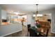 Eat-in kitchen boasts modern cabinets, breakfast bar and open layout to living room at 132 Picketts Creek Dr, Acworth, GA 30101