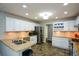Bright kitchen featuring granite countertops, stainless steel appliances, and ample cabinet space at 132 Picketts Creek Dr, Acworth, GA 30101