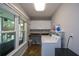Bright laundry room with large window, washer, dryer, and ample storage at 132 Picketts Creek Dr, Acworth, GA 30101