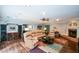 Large living room features hardwood floors, fireplace and multiple seating areas at 132 Picketts Creek Dr, Acworth, GA 30101