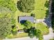 Aerial view of the home's roofline surrounded by lush greenery and a spacious yard showcasing the property's privacy at 170 White Rose Ln, Temple, GA 30179