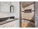 Bathroom featuring granite counters, white cabinets, and tiled walk-in shower with a bench at 170 White Rose Ln, Temple, GA 30179
