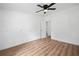 This bedroom features wood floors, a ceiling fan, and neutral walls at 170 White Rose Ln, Temple, GA 30179