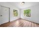 Bedroom featuring wood-look floors, natural light and a neutral color palette at 170 White Rose Ln, Temple, GA 30179