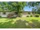 Charming single-story home with a well-maintained lawn, inviting entryway, and a large mature tree providing ample shade at 170 White Rose Ln, Temple, GA 30179