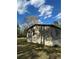 Side view of home with beige siding and a well-maintained lawn on a sunny day at 170 White Rose Ln, Temple, GA 30179