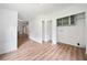 Laundry room featuring built in shelving and wood-look floors at 170 White Rose Ln, Temple, GA 30179