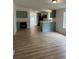 Open concept living area and kitchen with laminate floors and views of the outside at 170 White Rose Ln, Temple, GA 30179