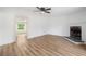 Living room featuring laminate floors, fireplace, neutral paint and natural light at 170 White Rose Ln, Temple, GA 30179