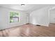 Bright living room featuring wood-look floors, natural light and a neutral color palette at 170 White Rose Ln, Temple, GA 30179