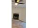 Living room featuring a traditional fireplace and contemporary flooring at 170 White Rose Ln, Temple, GA 30179